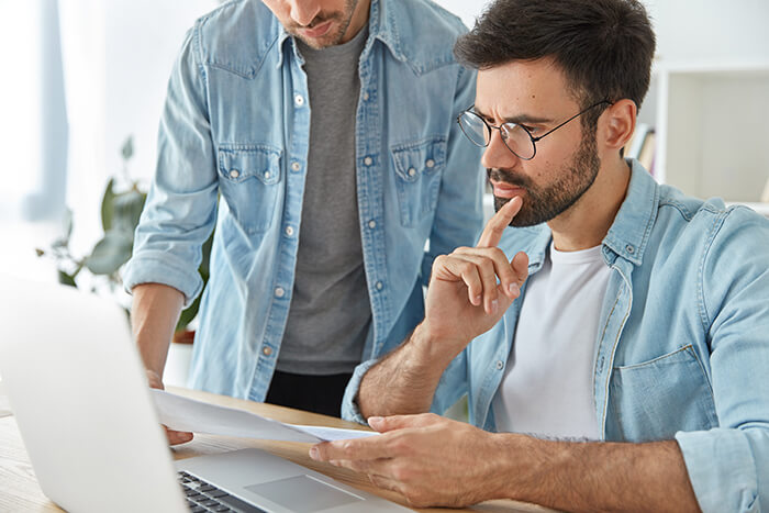 two-successful-stylish-man-financiers-analyze-business-documents-work-new-startup-project (1)